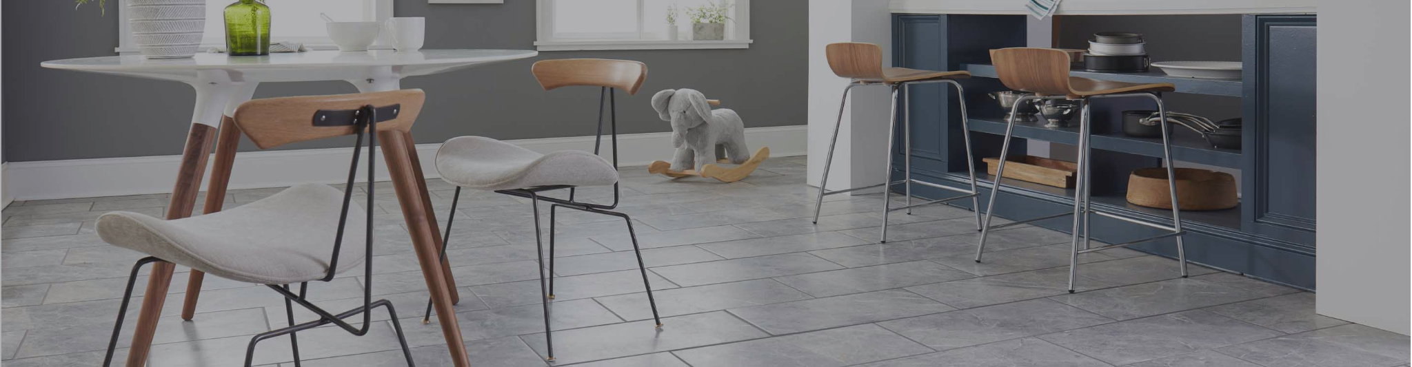 gray tile flooring in a dining area
