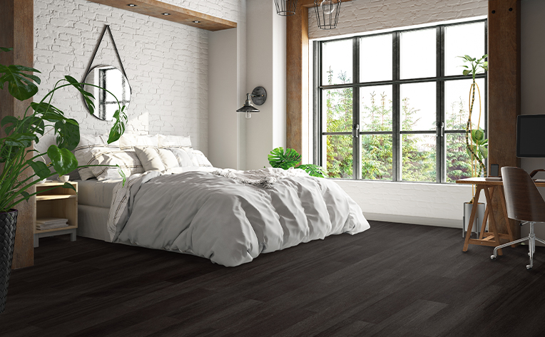 luxury vinyl flooring in a bedroom with a big window